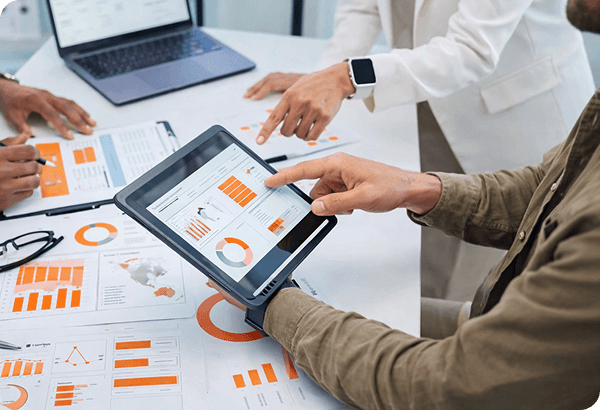 Team reviewing deliverables on tablet